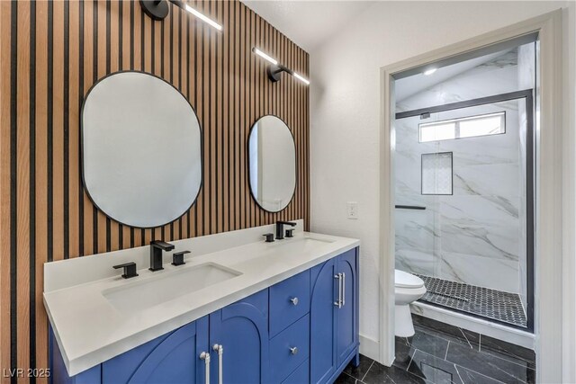 7413 Red Eagle St, Las Vegas, NV 89131 - bathroom with a marble finish shower, toilet, wallpapered walls, and double vanity
