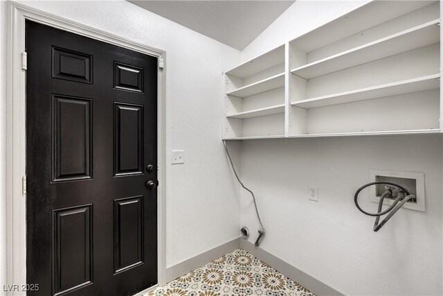 7413 Red Eagle St, Las Vegas, NV 89131 - washroom with hookup for a washing machine, baseboards, and tile patterned flooring