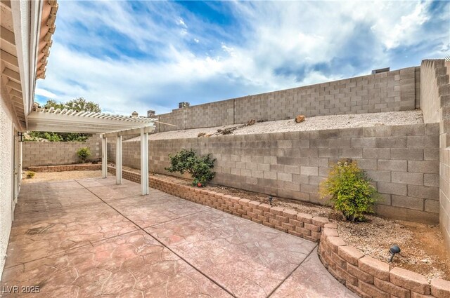 7413 Red Eagle St, Las Vegas, NV 89131 - view of patio featuring a fenced backyard and a pergola