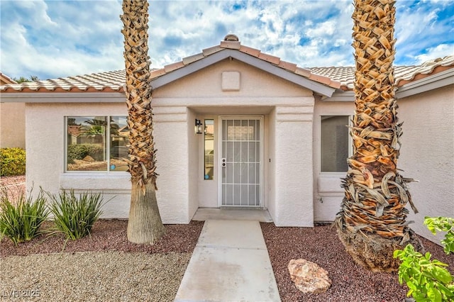 7413 Red Eagle St, Las Vegas, NV 89131 - property entrance featuring a tiled roof and stucco siding