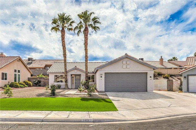 7413 Red Eagle St, Las Vegas, NV 89131 - view of front of house featuring stucco siding, a tile roof, a garage, driveway, and a chimney
