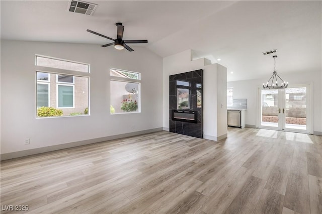 7413 Red Eagle St, Las Vegas, NV 89131 - unfurnished living room with a ceiling fan, light wood-style flooring, french doors, high vaulted ceiling, and baseboards