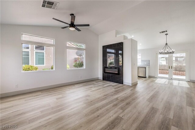 7413 Red Eagle St, Las Vegas, NV 89131 - unfurnished living room with a ceiling fan, light wood-style flooring, french doors, high vaulted ceiling, and baseboards