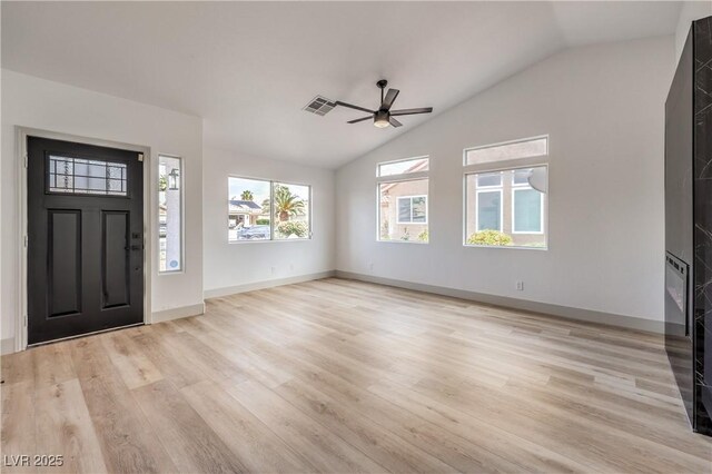 7413 Red Eagle St, Las Vegas, NV 89131 - foyer entrance featuring a ceiling fan, vaulted ceiling, light wood-style flooring, and baseboards