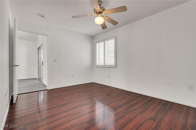 empty room with baseboards, ceiling fan, and wood finished floors