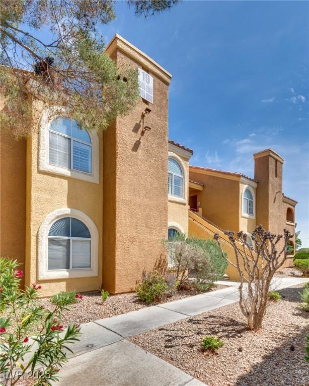 view of home's exterior with stucco siding