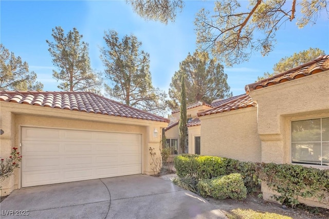 6961 Emerald Springs Ln, Las Vegas, NV 89113 - view of property exterior featuring a tile roof, stucco siding, and a garage