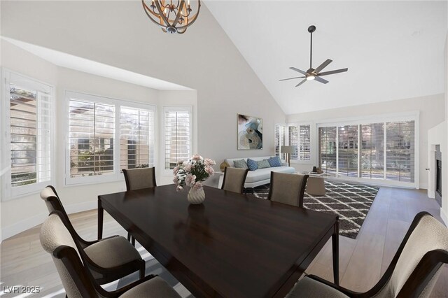 6961 Emerald Springs Ln, Las Vegas, NV 89113 - dining room featuring healthy amount of natural light, high vaulted ceiling, and light wood-style flooring