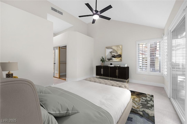 6961 Emerald Springs Ln, Las Vegas, NV 89113 - bedroom featuring vaulted ceiling, light colored carpet, a ceiling fan, and baseboards