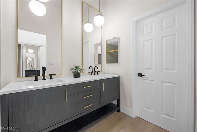 6961 Emerald Springs Ln, Las Vegas, NV 89113 - full bath featuring wood finished floors, double vanity, and baseboards