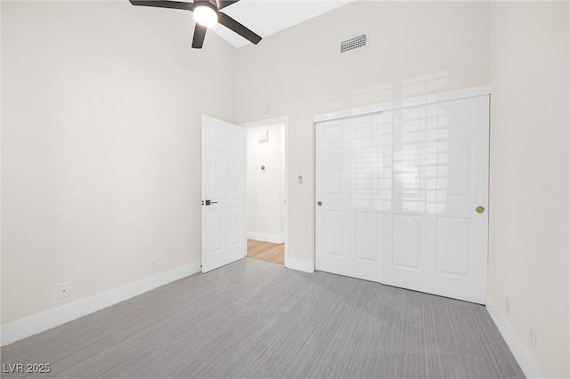 6961 Emerald Springs Ln, Las Vegas, NV 89113 - unfurnished bedroom with high vaulted ceiling, baseboards, ceiling fan, and a closet