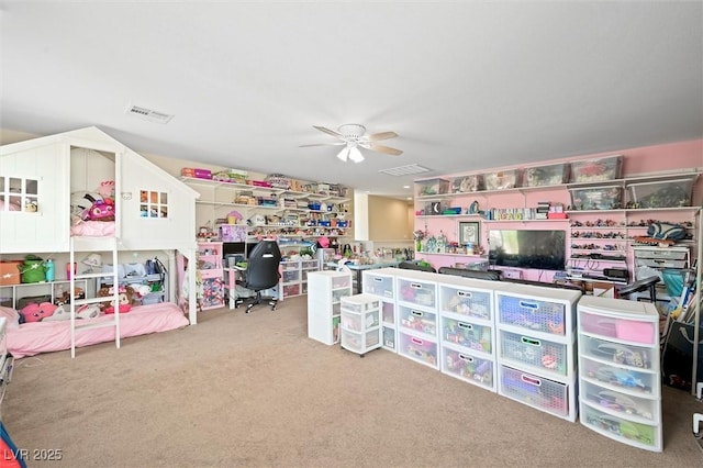 recreation room with ceiling fan, visible vents, and carpet