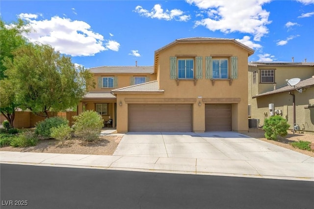 view of front facade with fence, an attached garage, stucco siding, cooling unit, and driveway