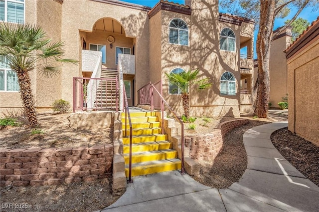 entrance to property with stucco siding