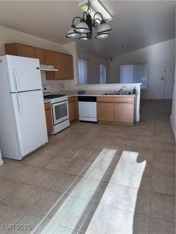 kitchen with a sink, white appliances, a chandelier, lofted ceiling, and under cabinet range hood