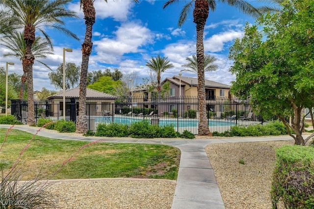 6868 Sky Pointe Dr Unit 1089, Las Vegas, NV 89131 - surrounding community featuring fence, a pool, and a lawn
