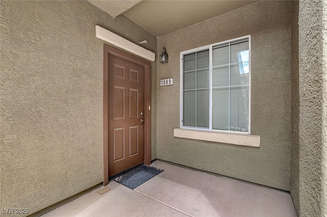 6868 Sky Pointe Dr Unit 1089, Las Vegas, NV 89131 - doorway to property with stucco siding