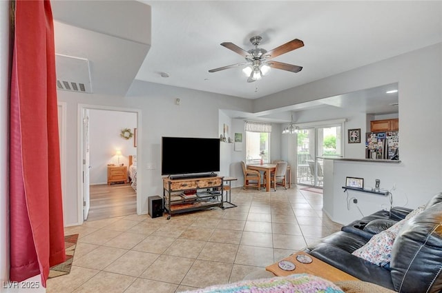 6868 Sky Pointe Dr Unit 1089, Las Vegas, NV 89131 - living room featuring baseboards, ceiling fan, light tile patterned floors, and visible vents