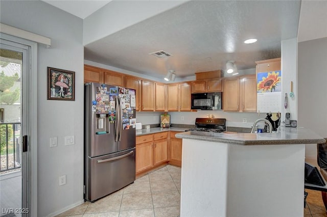 6868 Sky Pointe Dr Unit 1089, Las Vegas, NV 89131 - kitchen with black microwave, range with gas stovetop, light tile patterned floors, stainless steel refrigerator with ice dispenser, and visible vents