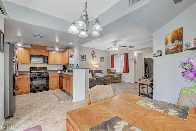 6868 Sky Pointe Dr Unit 1089, Las Vegas, NV 89131 - dining area featuring visible vents, ceiling fan with notable chandelier, and light tile patterned floors