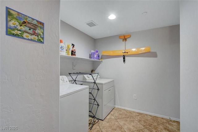 6868 Sky Pointe Dr Unit 1089, Las Vegas, NV 89131 - laundry room with laundry area, visible vents, washer and dryer, baseboards, and light tile patterned floors