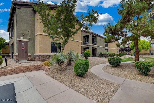 6868 Sky Pointe Dr Unit 1089, Las Vegas, NV 89131 - exterior space with stucco siding and stone siding