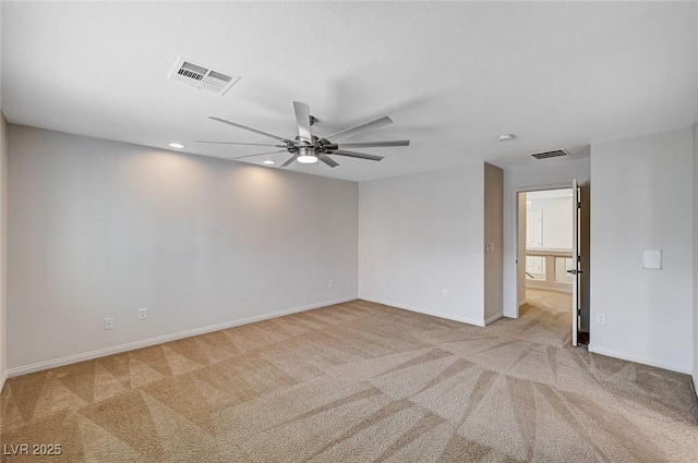empty room with carpet floors, ceiling fan, recessed lighting, and visible vents
