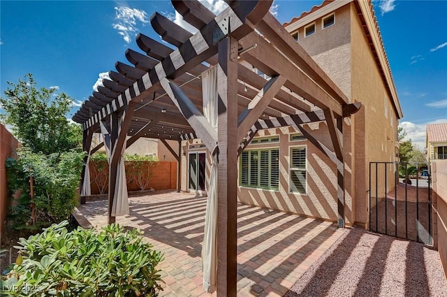 view of patio with fence and a pergola