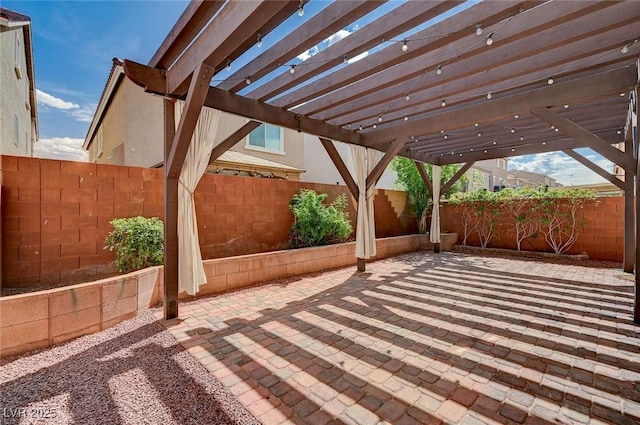 view of patio / terrace with a fenced backyard and a pergola