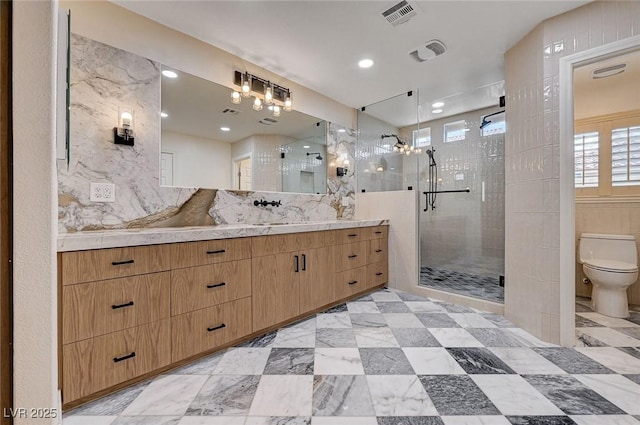 bathroom with toilet, visible vents, a wealth of natural light, and a stall shower