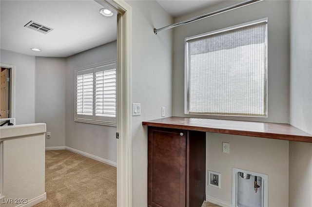 clothes washing area with laundry area, visible vents, baseboards, recessed lighting, and light colored carpet