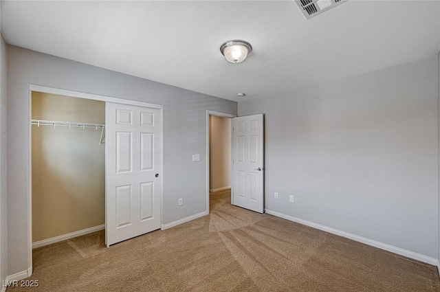 unfurnished bedroom with visible vents, carpet flooring, and baseboards