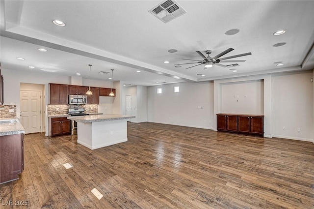 kitchen featuring visible vents, open floor plan, dark wood-style floors, recessed lighting, and stainless steel appliances