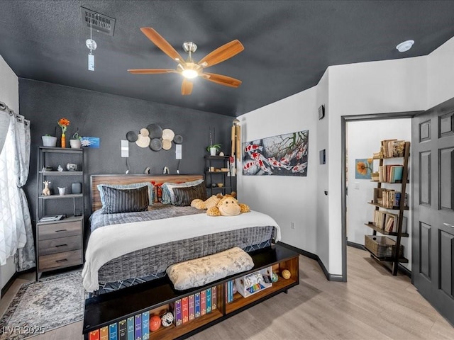 6324 Desert Leaf St Unit 3, North Las Vegas, NV 89081 - bedroom with baseboards, ceiling fan, visible vents, and wood finished floors