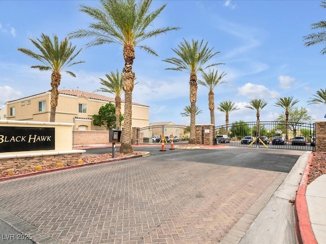 6324 Desert Leaf St Unit 3, North Las Vegas, NV 89081 - view of street with a gated entry, a gate, and curbs