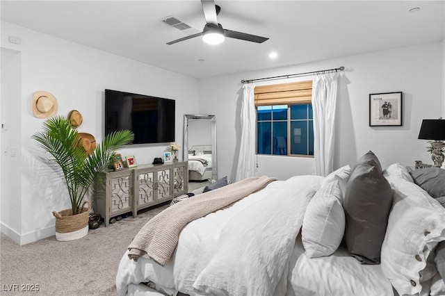 carpeted bedroom with ceiling fan, visible vents, and baseboards