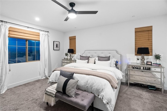 bedroom with ceiling fan, baseboards, and carpet
