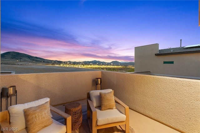 balcony featuring a mountain view