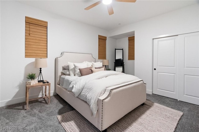 bedroom with baseboards, a ceiling fan, a closet, and dark carpet
