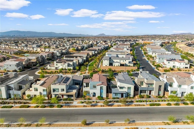 birds eye view of property featuring a mountain view and a residential view