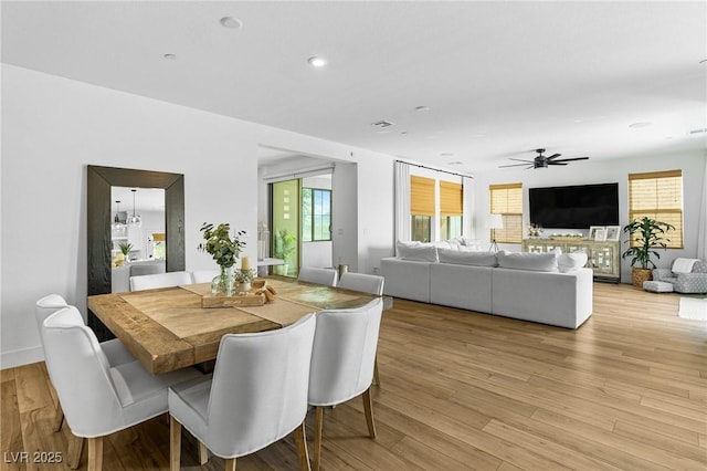 dining room featuring recessed lighting, a ceiling fan, light wood finished floors, and a healthy amount of sunlight