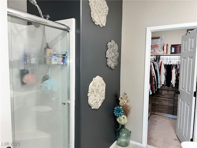 2585 Amazing Meadows Ave Unit 1007, North Las Vegas, NV 89031 - full bathroom featuring a spacious closet and a shower stall