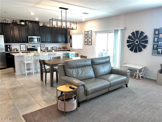 2585 Amazing Meadows Ave Unit 1007, North Las Vegas, NV 89031 - living area featuring visible vents and light tile patterned flooring