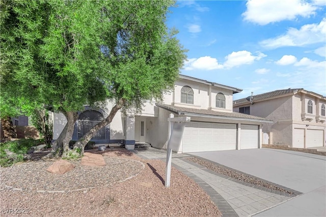 2808 Deep Water Cir, Las Vegas, NV 89117 - view of front of property featuring stucco siding, driveway, and an attached garage