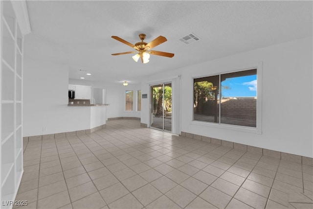 2808 Deep Water Cir, Las Vegas, NV 89117 - unfurnished living room with ceiling fan, light tile patterned floors, and recessed lighting