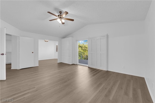 2808 Deep Water Cir, Las Vegas, NV 89117 - unfurnished living room with ceiling fan, lofted ceiling, wood finished floors, and baseboards