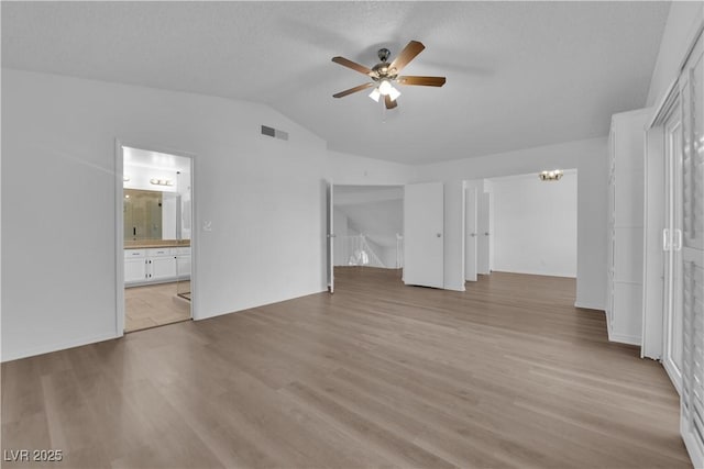 2808 Deep Water Cir, Las Vegas, NV 89117 - unfurnished bedroom with lofted ceiling, light wood-style flooring, ensuite bath, and a ceiling fan