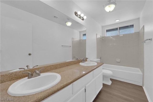 2808 Deep Water Cir, Las Vegas, NV 89117 - full bathroom with toilet, double vanity, wood finished floors, and shower / tub combination