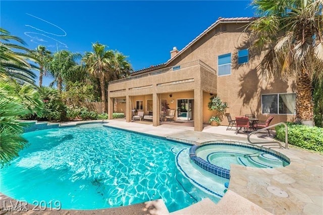 7751 Locke Haven Dr, Las Vegas, NV 89123 - view of pool with a patio area, a pool with connected hot tub, and an outdoor living space
