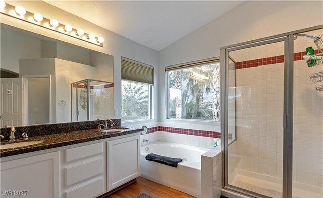 7751 Locke Haven Dr, Las Vegas, NV 89123 - full bath with vaulted ceiling, plenty of natural light, a garden tub, a stall shower, and double vanity